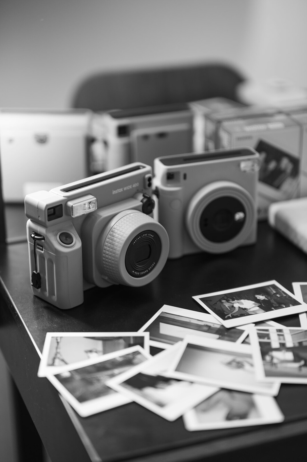 Vintage film camera and printed photographs on a table
