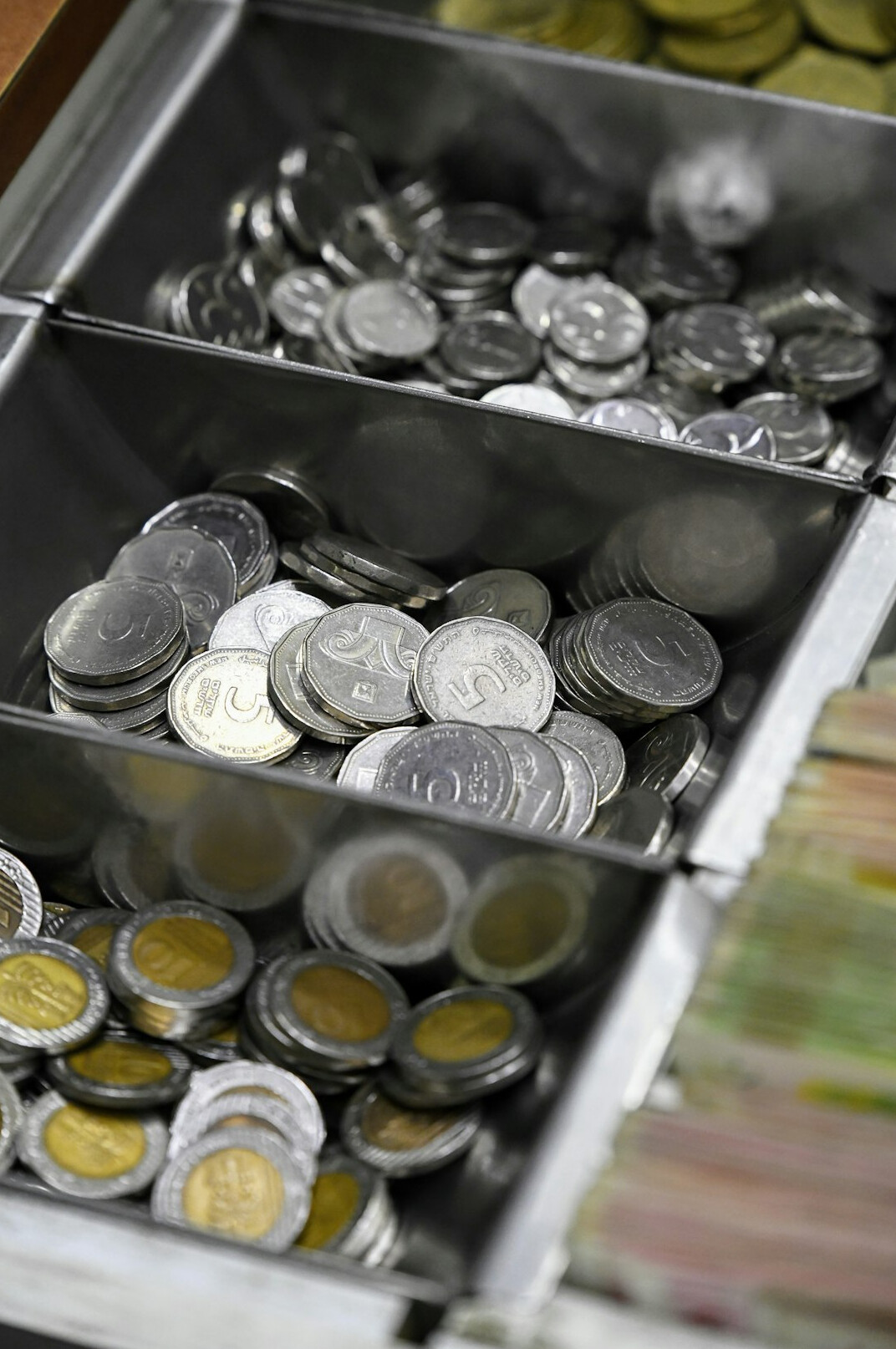 coin collector examining pieces