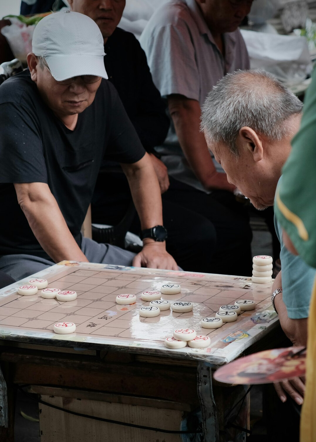people playing traditional board game